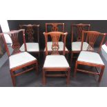 A harlequin set of six Chippendale style dining chairs with pierced vase splats and drop in seats.