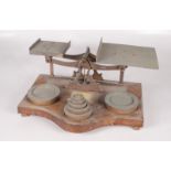 A large set of brass postal scales, late 19th/early 20th century,