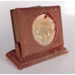 A late Victorian red velvet lined photograph album on stand,