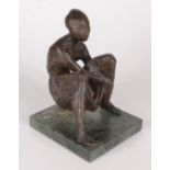 A bronze figure of a seated woman, signed 'Szegedi', on a green marble square base, height 18cm,