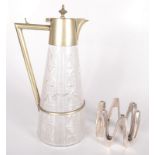 A silver plated and cut glass claret jug, height 29cm and a plated candle holder by Dansk Designs,