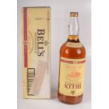 A large bottle of Bell's Extra Special Old Scotch Whisky, aged 8 years, 4.
