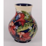A Moorcroft pottery 'Simeon' pattern vase, by Philip Gibson, shape 869,