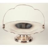 A silver hexafoil footed cake basket with swing handle, Sheffield 1917, 16.4oz.