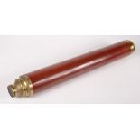 A single draw brass and wood telescope, extended length 89.5cm.