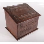 An oak carved salt box, 19th century, the interior with later added compartments, height 25cm,