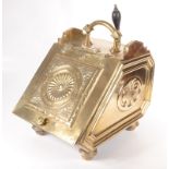 An Arts and Crafts brass coal box, the hinged lid with embossed decoration, maker's mark H.