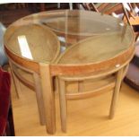 A G Plan style circular teak coffee table with nest of three smaller tables, diameter 81cm.