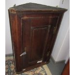 A George III oak corner cupboard,