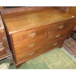 A late Victorian pitch pine chest of drawers, with two short and two long drawers on bracket feet,