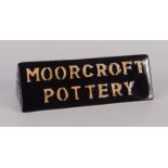 A Moorcroft pottery triangular freestanding plaque,