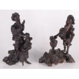 A pair of Chinese carved root wood figures on stands, 19th century,