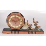An Art Deco black slate and marble mantle clock, with a 14.