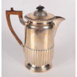 A late Victorian half fluted hot water jug in George III style, London 1895, 13.5oz.