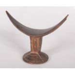 An African headrest, possibly north Nigerian, the circular base,