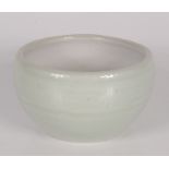 A Leach pottery celadon glaze bowl, height 7.5cm, diameter 12.7cm.