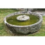 A large circular granite cider press, height 40.5cm, diameter 152.5cm, central diameter 51cm.