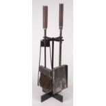 A post war metal fireside companion set, with wooden handles, height 51.5cm.