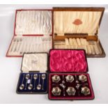 A cased set of six silver plated open salts and spoons,
