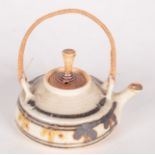 A Mary Rich miniature porcelain teapot, with a rattan covered handle, height 7cm, diameter 9cm.