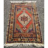 A Turkish rug, with a large central polychrome medallion,