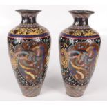 A pair of Japanese cloisonne vases, 19th century, decorated with exotic birds,