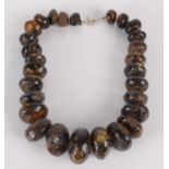 A graduated 'amber' bead necklace. Condition report: 36.1g.
