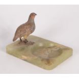 A continental cold painted bronze model of a pheasant, on a green onyx base, height 11cm,