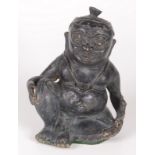 A South East Asian bronze of a seated man, 18th/19th century, height 20cm, width 14cm, depth 12.5cm.