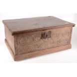 A 17th century boarded small chest, the top with moulded edge,