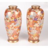 A pair of Japanese Satsuma pottery millefleur vases, character marks to base, height 24.5cm.