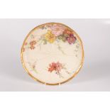 A Royal Worcester blush ivory plate, decorated with floral sprays, impressed nos.