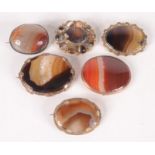 Six agate brooches.