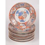 Ten Japanese Imari plates, early 19th century, each with red six character mark to base,
