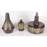 Three Celtic Pottery table lamps, heights 21cm, 24cm and 28.5cm.