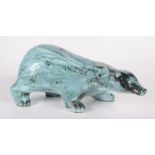 A David Sharp Rye Pottery model of a badger, signed to base, height 16cm, width 12.5cm, length 36cm.