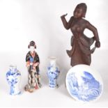 A Japanese porcelain figure of a mother and child, early 20th century, height 31cm,