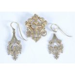 A pair of silver gilt baroque style earrings and a similar silver gilt brooch/pendant.