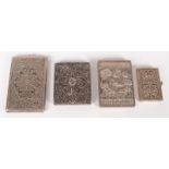 An Indian silver visiting card case, one side decorated with natives and wild animals,