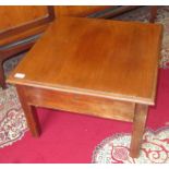 An Arts and Crafts mahogany low centre table, with a single frieze drawer on square chamfered legs,