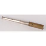 A brass three draw telescope, extended length 36cm.