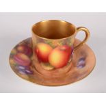 A Royal Worcester fruit painted coffee can and saucer, with gilt interior and handle,