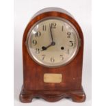 A mahogany mantle clock, the silvered 14cm dial with arabic numerals, height 29.5cm, width 21.