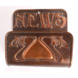 An Art Nouveau copper wall mounted rack, inscribed 'NEWS', height 21cm, width 21cm, depth 9.3cm.