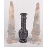 A serpentine baluster vase, height 23cm and a pair of hardstone obelisks, height 32cm.