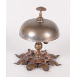 An Arts and Crafts copper and brass desk bell, height 11.5cm.