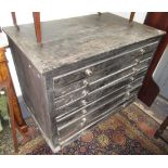 A black painted pine plans chest, with eight long drawers on a plinth base, height 92cm,