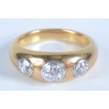 A heavy high purity gold ring set with three diamonds,
