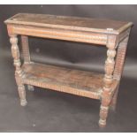 An oak credence table in early 17th century style with two tiers on carved bulbous supports,