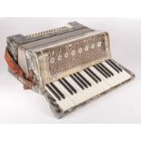 A Bonelli piano accordion, height 39cm, width 46cm, depth 24cm.